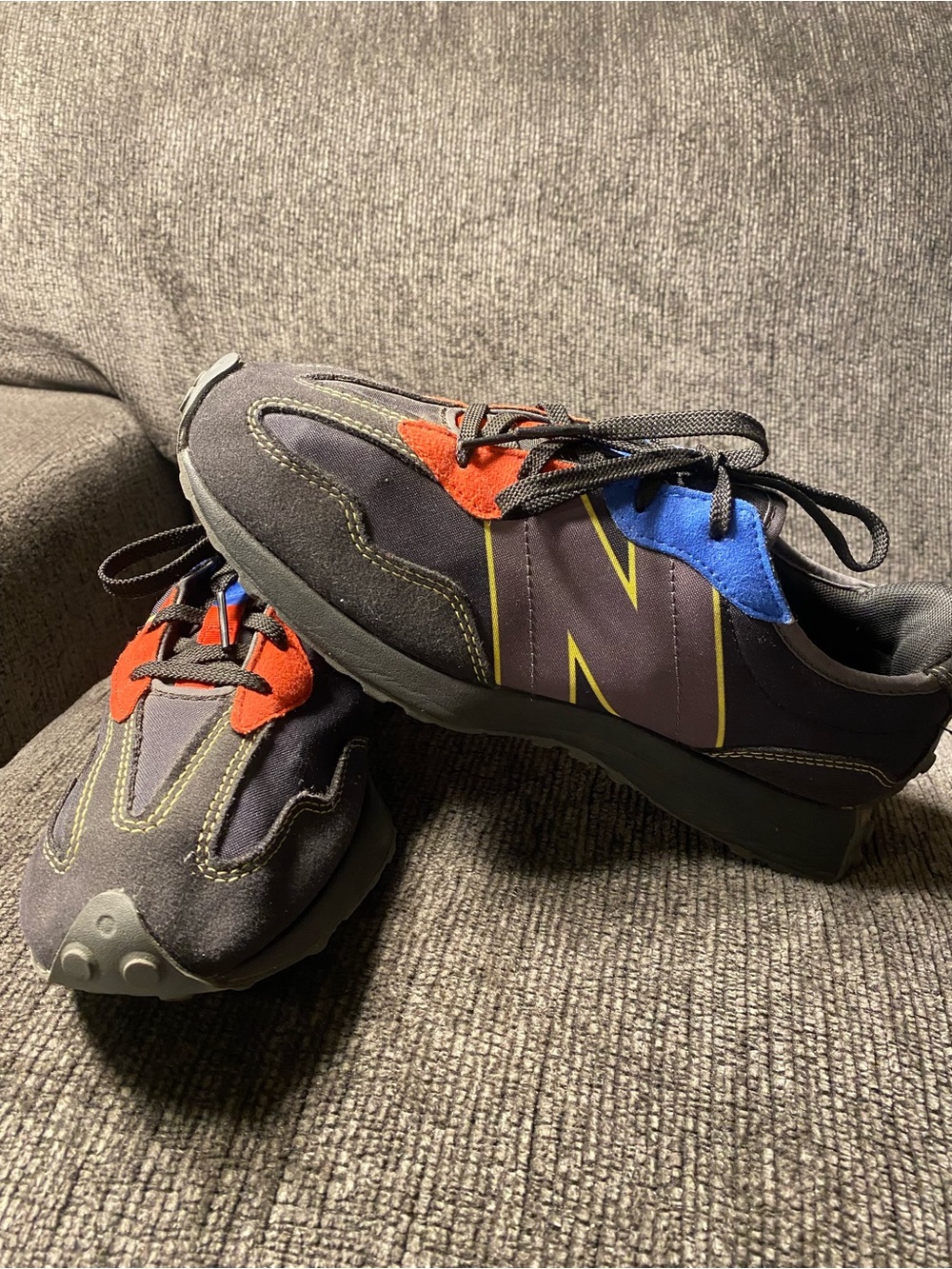 New Balance Dark Gray Sneakers with Red & Blue Accents